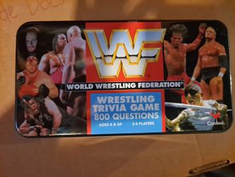1997 Cardinal Industries WWF World Wrestling Federation Wrestling Trivia Game in a collectible tin.