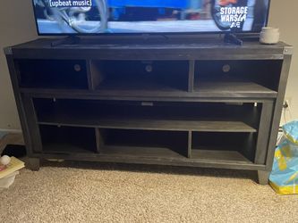 For A 60 In Tv Stand Black With silver Hardware.