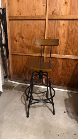 Dark wood rotating bar stool