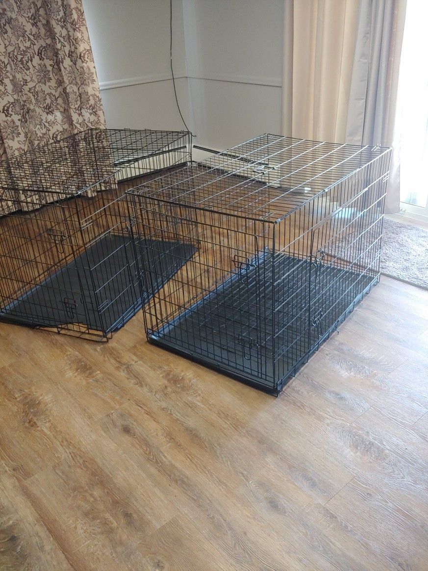 2EA Large Dog Crates. 30"W 48"L 32" Tall Good Condition It Fit Our German Shepherds