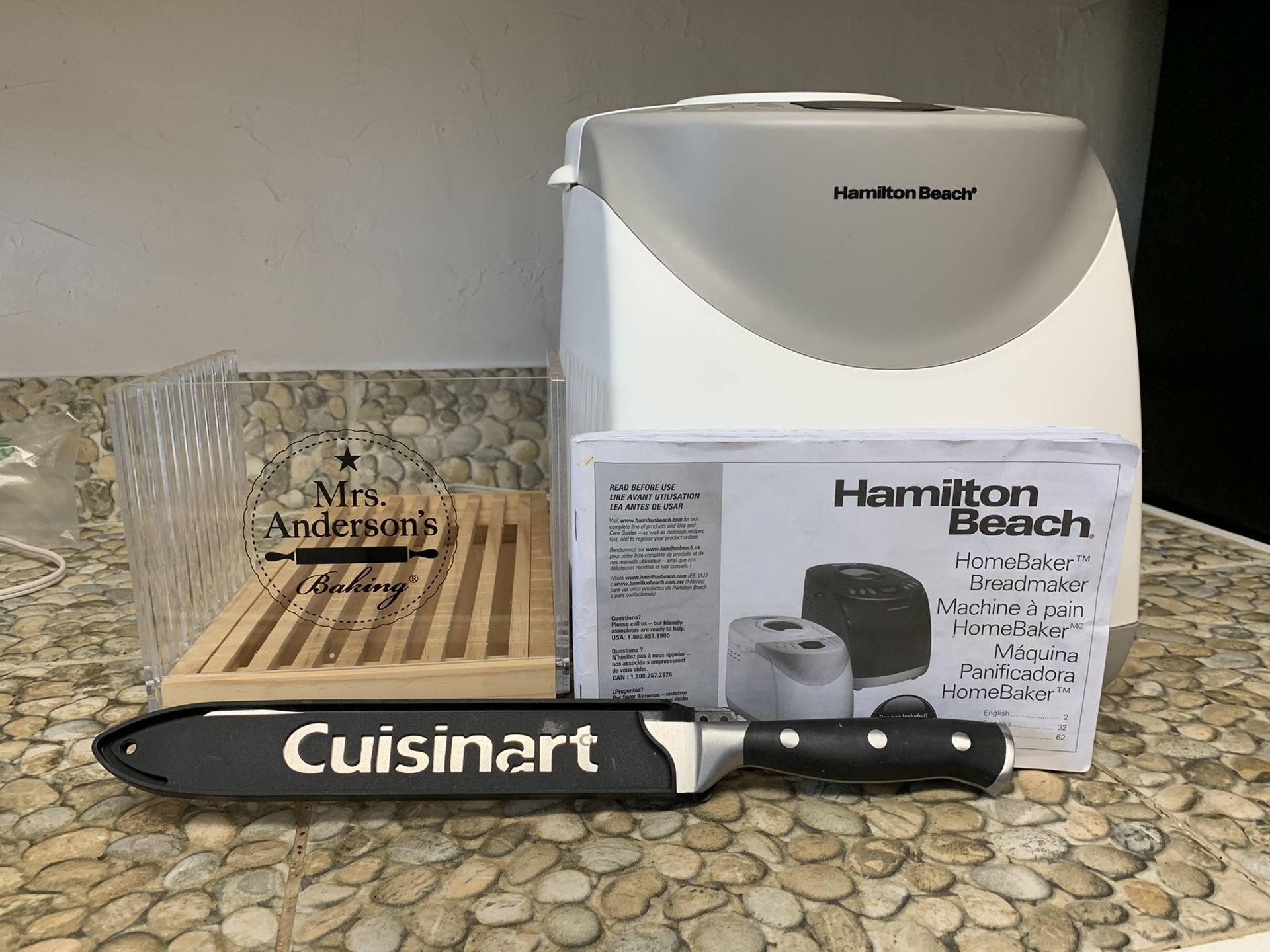 Hamilton Beach 2 lb, 12 cycle programmable bread maker with Mrs. Anderson’s cutter and Cuisinart bread cutter. Instructions included.