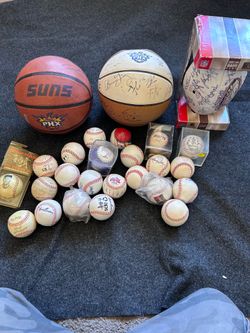 Autographed baseballs footballs basketball