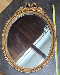 Vintage Gold Oval Mirror with Bow Crest