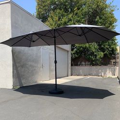 $130 (New in box) Large 15ft double sided outdoor umbrella w/ 65 lbs plastic weight base (red/gray)