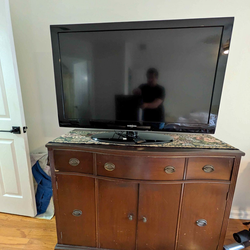 Antique sideboard. TV and Roku work great too!Price Is Firm