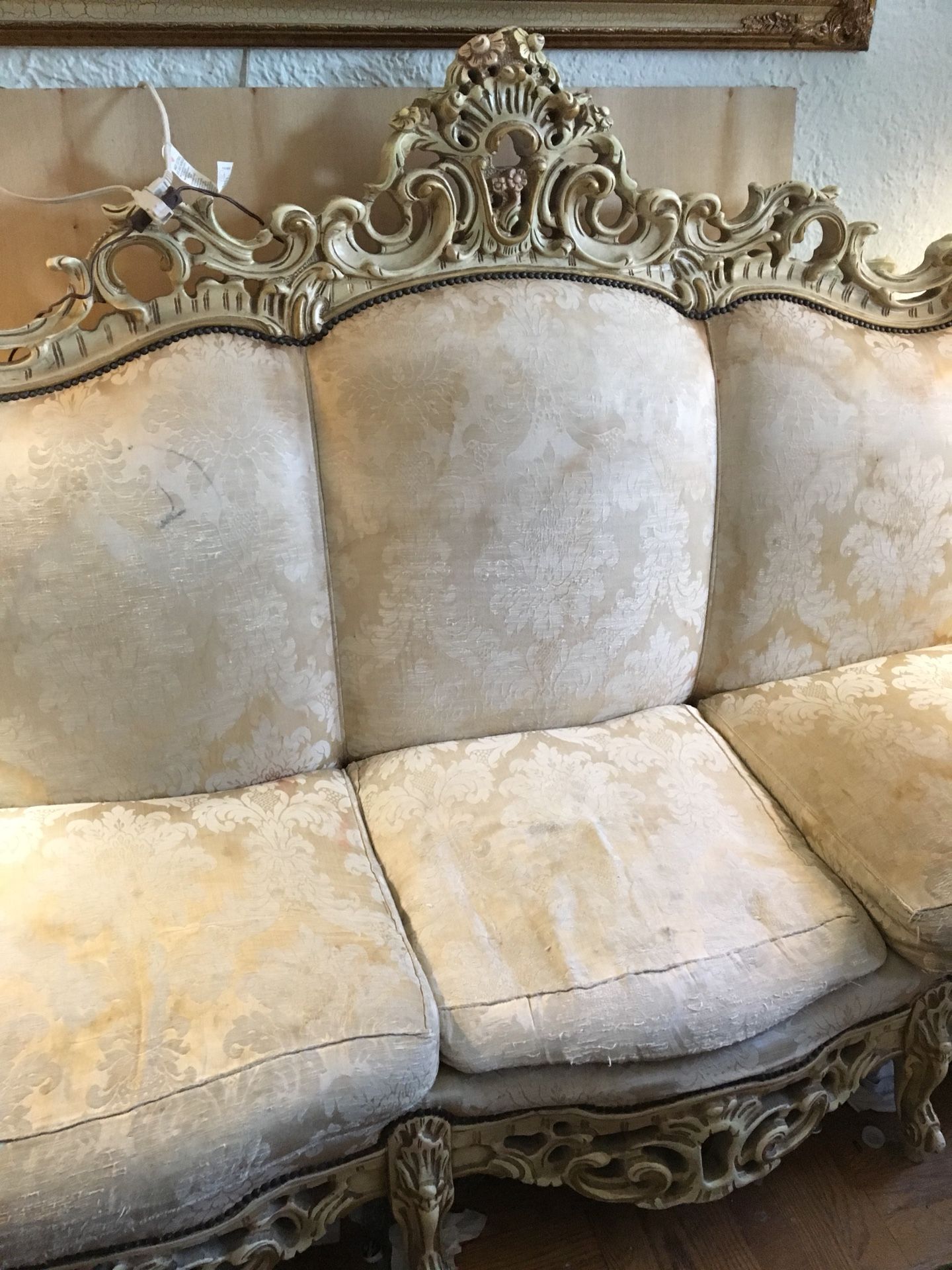 Antique sofa and love seat needs to be reupholstered.