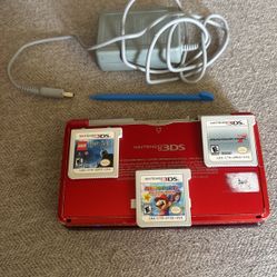 Nintendo 3DS, three games, and charger