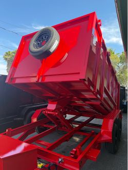 Scissor lift dump trailer