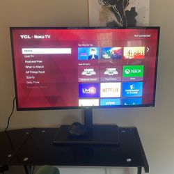 TCL 40 inch Tv With Tv Stand Mounted. 
