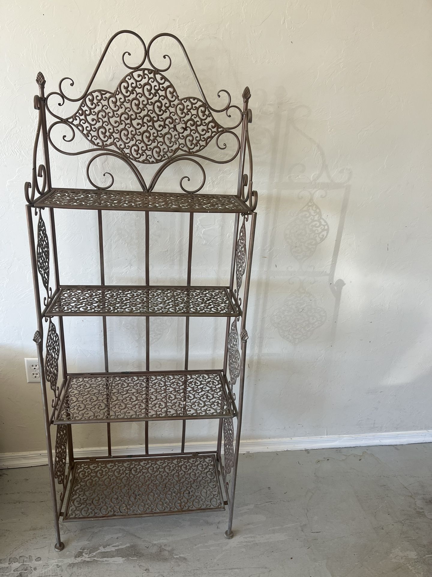 Beautiful antique bronze four-tiered baker's rack or plant stand
