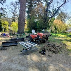 Two Ariens S14H Garden Tractors, Implements And Loading Ramps