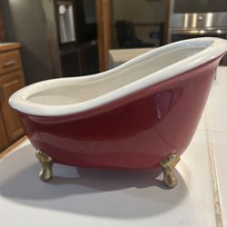 vintage ceramic item is a retired Bath & Body Works claw foot bathtub holder, designed for displaying soap or other small bathroom accessories.     De
