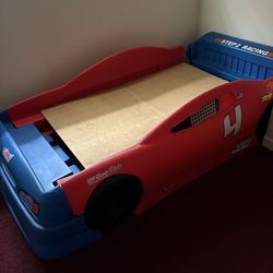Child’s race car bed with twin size mattress
