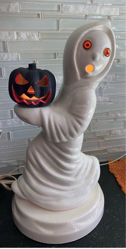This is a vintage ceramic Halloween ghost and jack-o'-lantern light-up lamp, typically standing about 12 inches tall