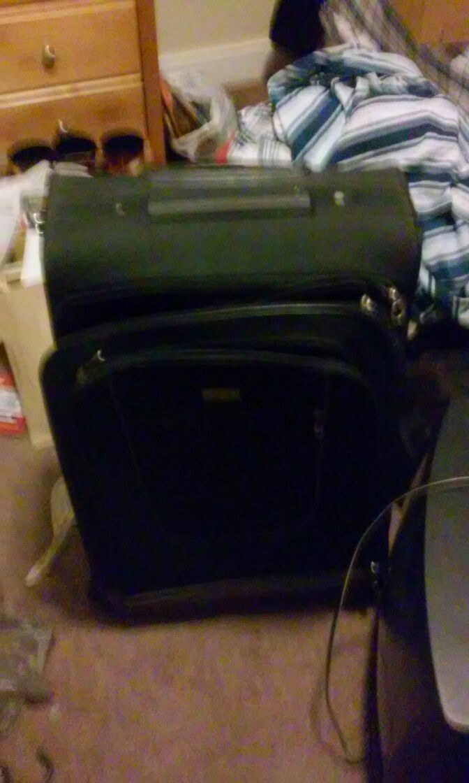 Suit case with duffle bag and carry in bag