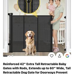Retractable baby gate.  NEW 