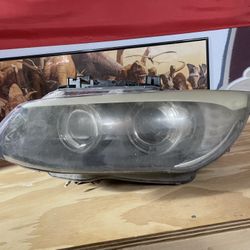 2011 BMW left headlamp