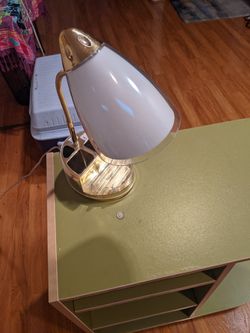 Desk lamp with connection for electronics and phone