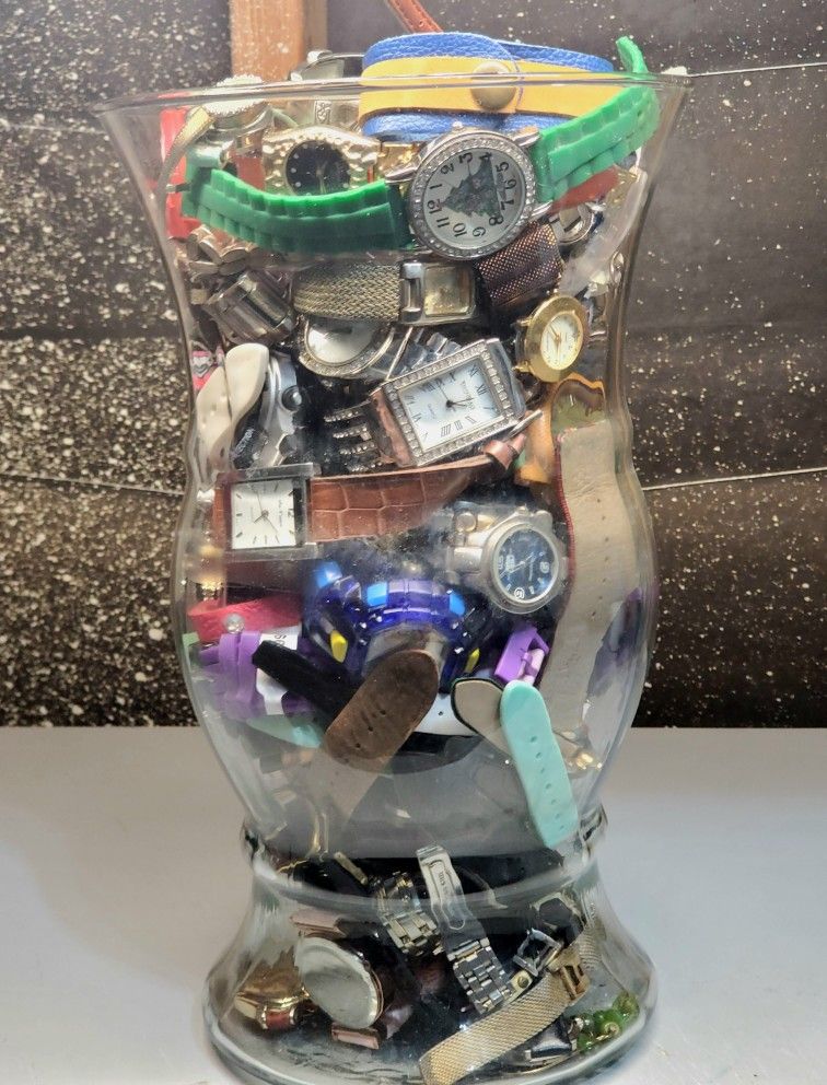 Glass Vase Full Of Collectible Wristwatches