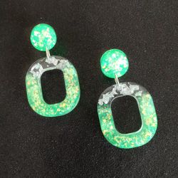Neon green glow oval shaped dangle earrings with silver foil and iridescent opal glitter 