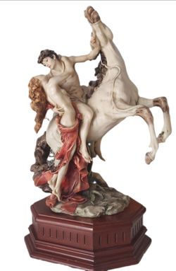 “Large Giuseppe Armani-style ‘The Embrace’ sculpture, approximately 25 inches tall, on wooden base. Unmarked/unsigned; authenticity not verified.”