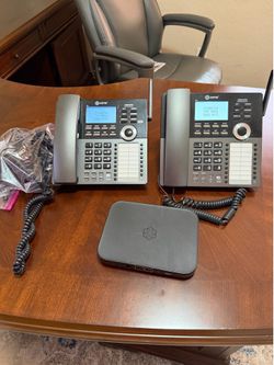 Ooma office phones and base.