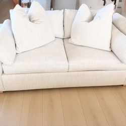 One white natural fabric loveseat cloud couch Living Spaces Nate Berkus Jeremiah