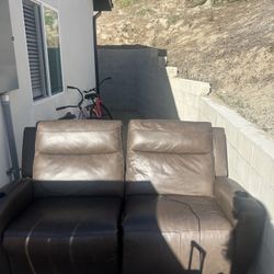 Brown couch (automatic recliner)