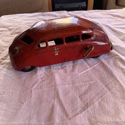 1930s scarab wind up tin toy