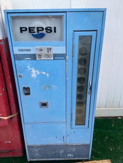 Vintage Coca Cola and Pepsi vending machine