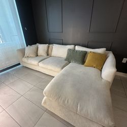 sectional beige couch with extra covers pillows included 