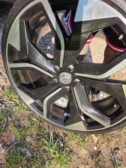Four 22-inch rims, four new tires, not bent or dented.