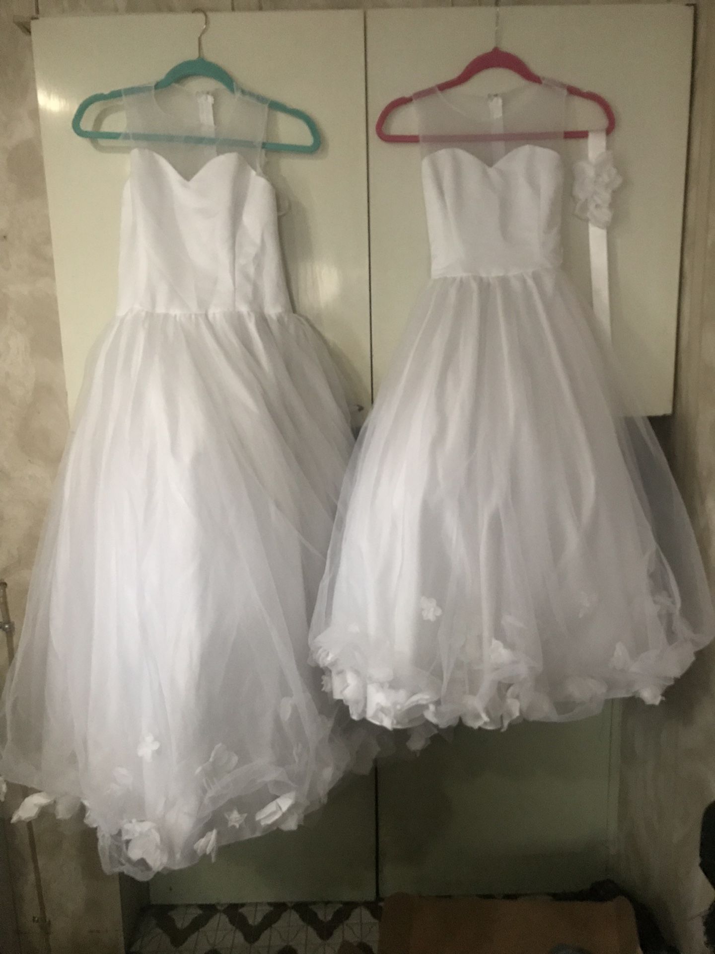 2 Flower girl dresses used once size 7/8 and 10/12.