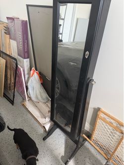 Mirror with jewelry holder