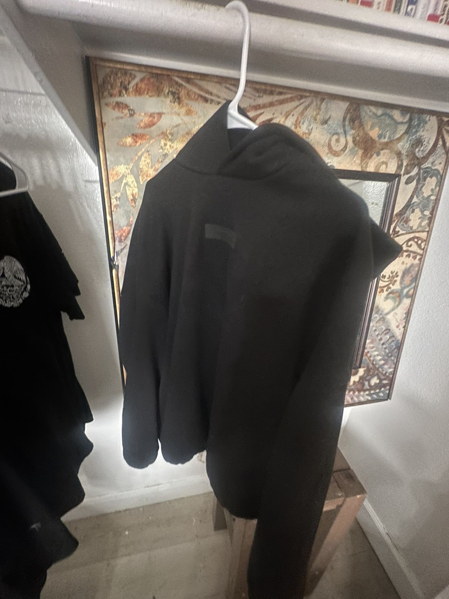 ESSENTIALS (Center logo)