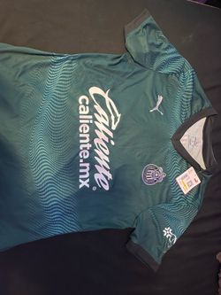 Puma Club Deportivo Guadalajara 2025/26 home shirt with green and blue wavy pattern
