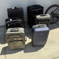 2 Medium & 4 Carry On Suitcases 