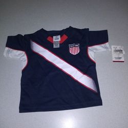 CHILDS 18 MONTH USA TEAM APPAREL JERSEY/SHIRT FROM UNITED STATES OLYMPIC COMMITTEE NEW WITH TAGS