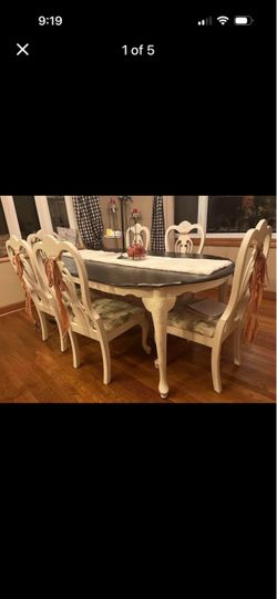 Rustic farmhouse dining table with six chairs
