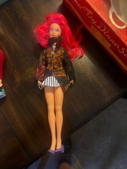 Vibrant, vintage fashion, doll has neon peak hair and blue eyes