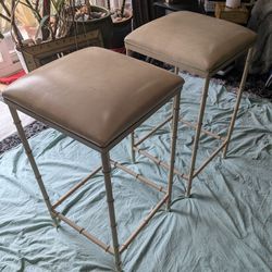 Set of Amisco easy counter stools featuring a beige leather seat bar stools.