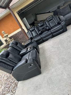Beautiful black leather sofa set with details has lights and speakers recliners get stuck no picking