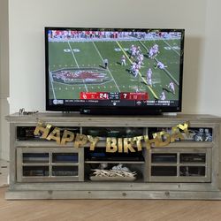 Sony 55 inch Sony Flatscreen TV, Solid Wood TV Stand, two sofas, one is a sleeper sofa.