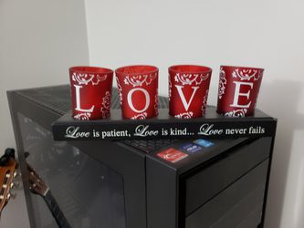 Beautiful red glass cups with Love spelled out with candles inside.all lights work