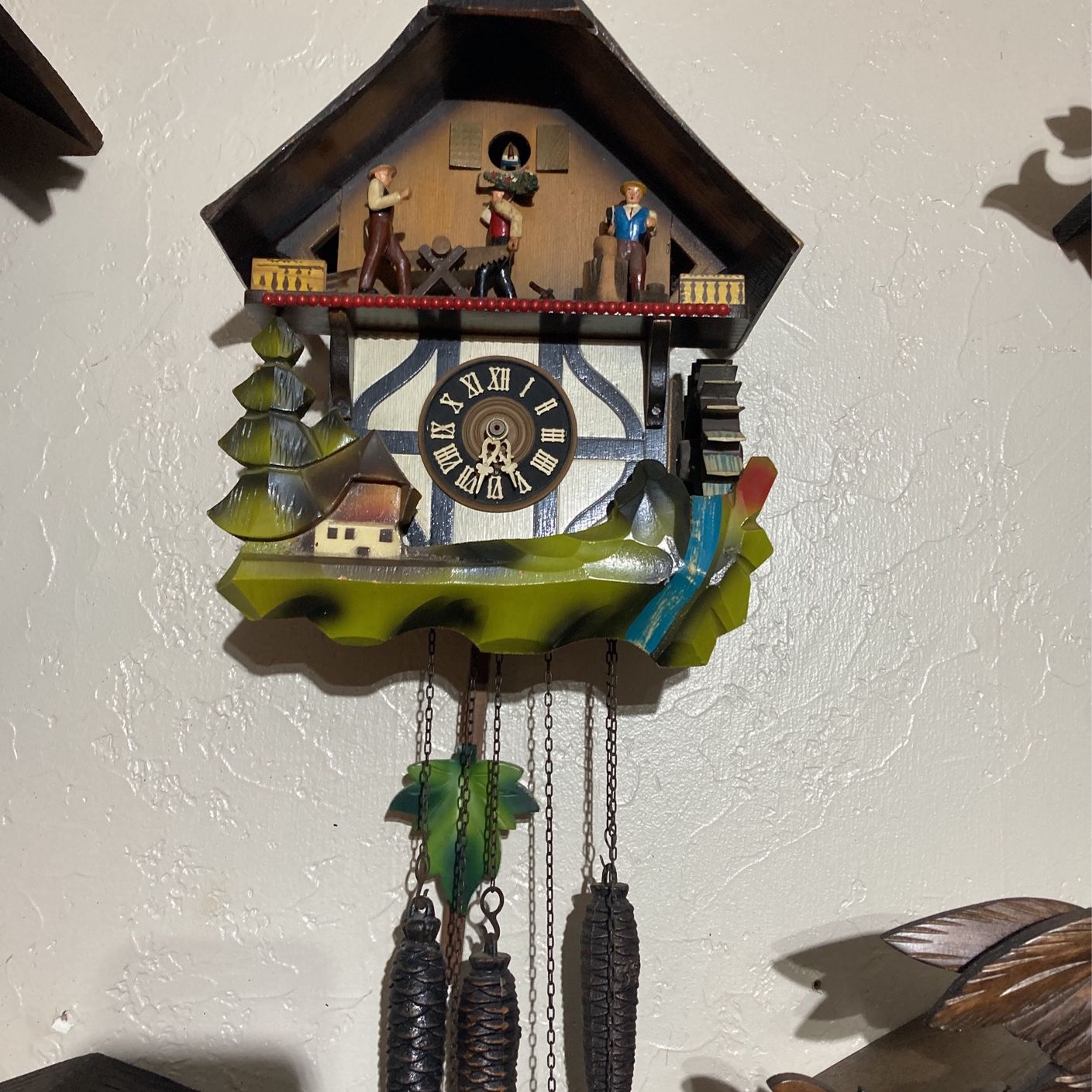Chalet Wood Chopping Guy With Water Wheel Cuckoo Clock