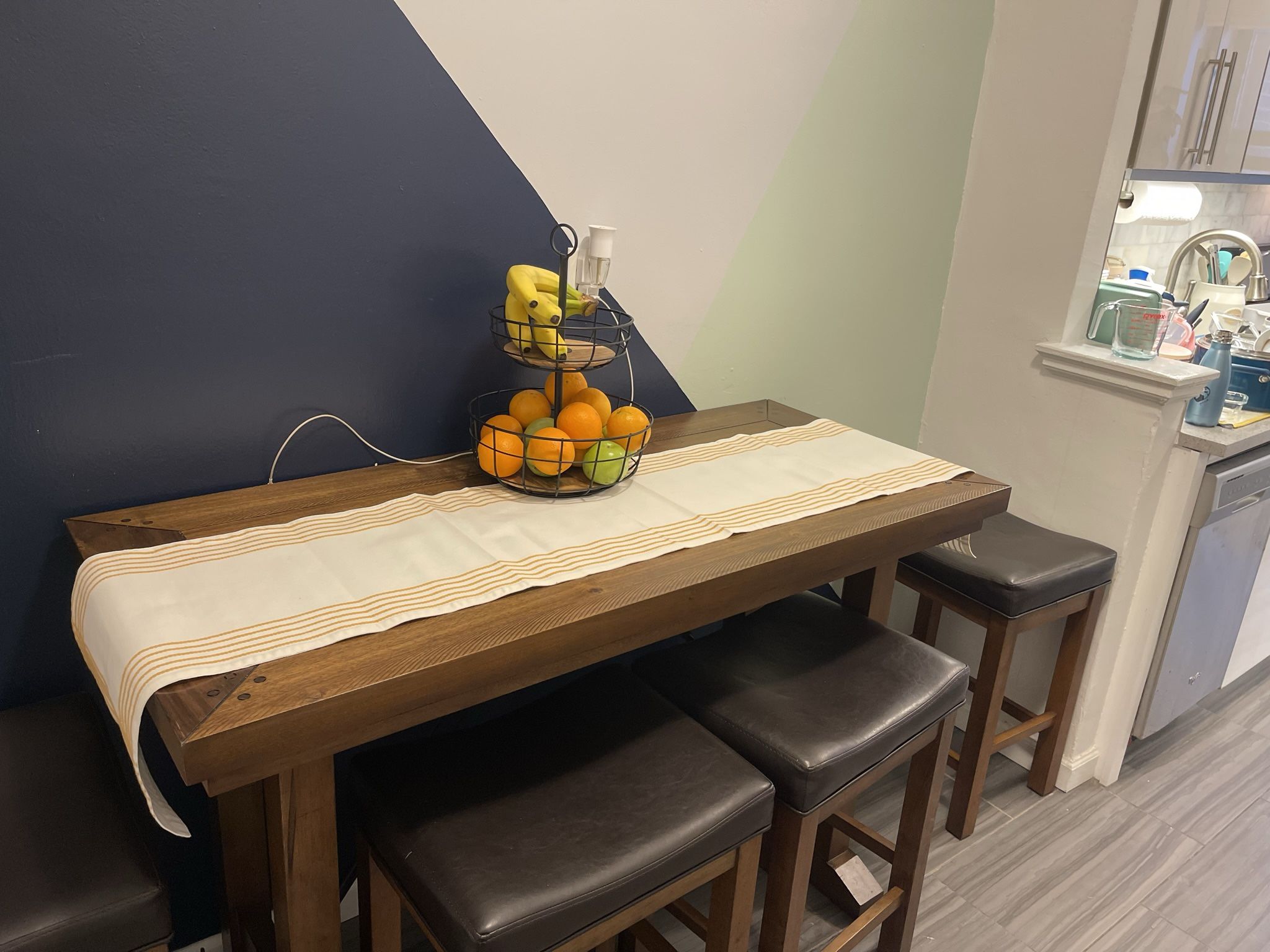 Dark wood dining table with matching chairs