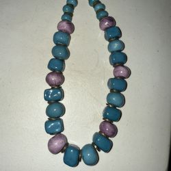 A hand-formed ceramic bead necklace by Australian potter Doyle Lane.