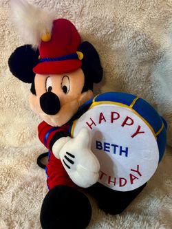 2000s Mickey Mouse holding a drum