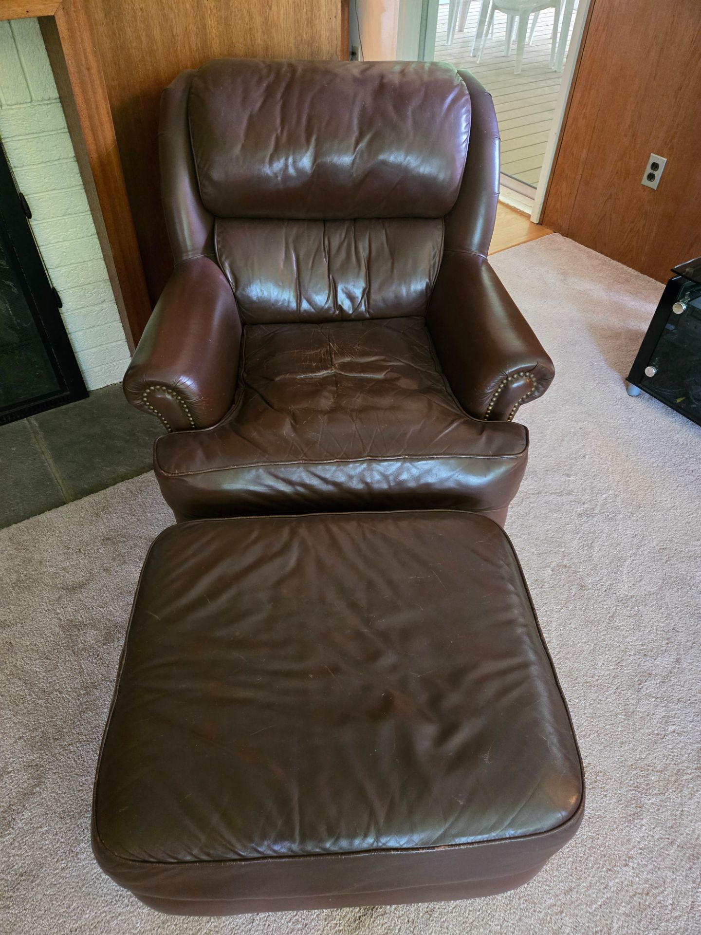 Brown leather chair and ottoman