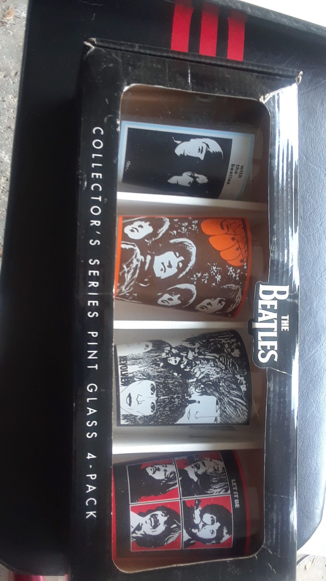 Collection of four Beatles pint glasses brand new